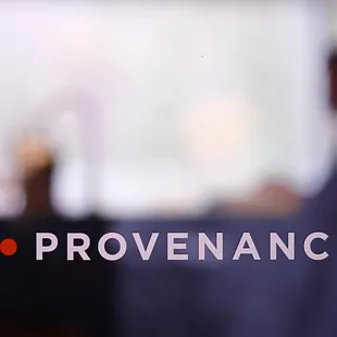 a blurry image of a man in the background