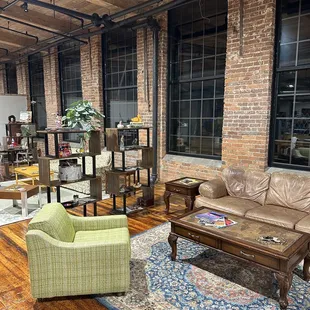 a living room with exposed brick walls