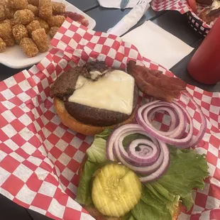 Beyond Meat burger with cheese. Side of tots