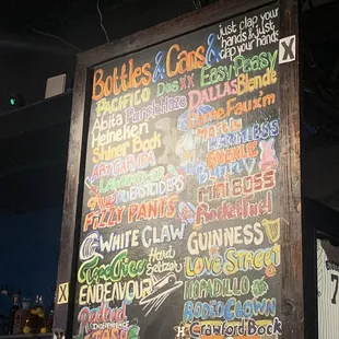 a chalk board with a variety of drinks