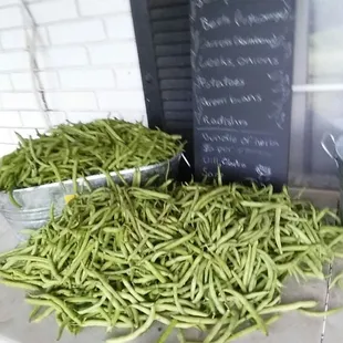 a pile of green beans on a table