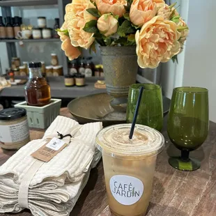 a glass of iced coffee with a straw