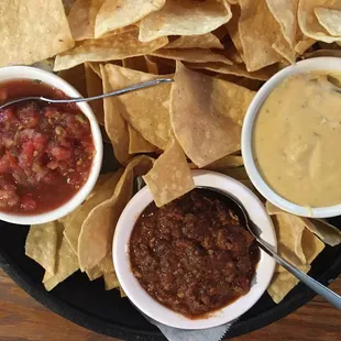 Queso, Salsa and Chili with chips.