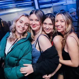 a group of women posing for a picture