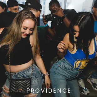 a group of people dancing at a party