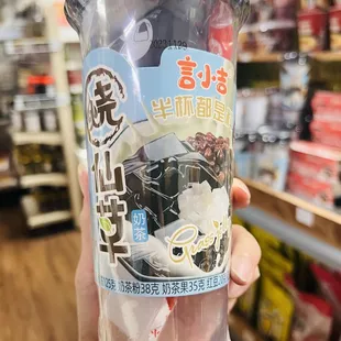 a person holding a plastic cup