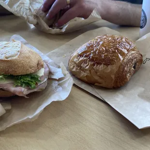 Pesto, Turkey (?), cheese sandwich and pain au chocolate.