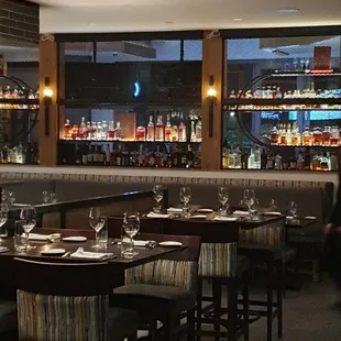 Dining room with bar in the background.