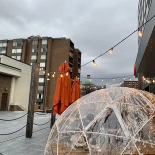 an orange raincoat and an orange umbrella