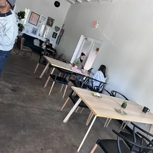 a man standing in a coffee shop