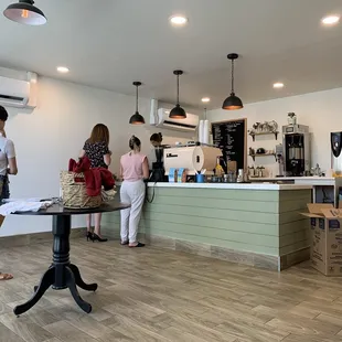 people standing in a coffee shop