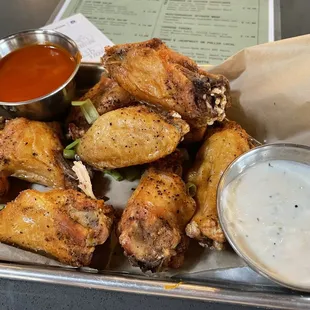 Wings with buffalo sauce and tzatziki sauce as dips (these wings were perfectly cooked!)