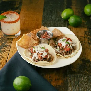 a plate of tacos and a margarita