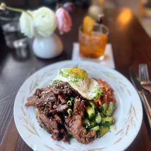 Special of the day: Bulgogi with rice and homemade kimchi and cucumbers. Topped with egg, of course.