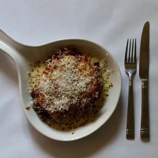 a plate of food with a fork and knife