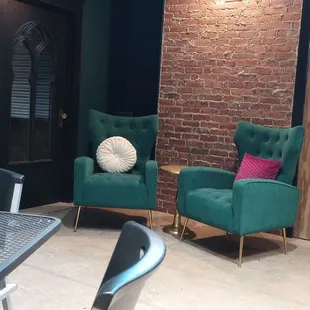 Beautiful tasting room with tables for four, comfortable chairs or a members lounge.