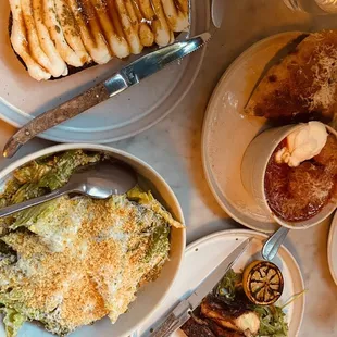 Appetizer spread!  Ricotta toast, spicy Caesar salad, meatballs, octopus