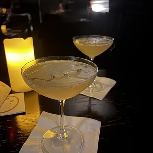 two glasses of cocktail on a table
