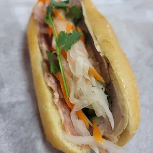 a sub sandwich with meat and vegetables