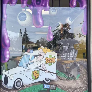 a woman driving a car through a window