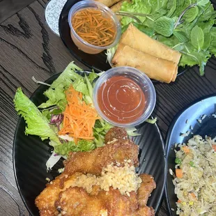 Garlic butter wings, pork and vegetable egg rolls and combination fried rice (beef, chicken and shrimp)