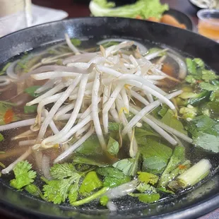 Large bowls withe great tasting base broth.   I had the chicken and the portion was huge and had a good mix of items.