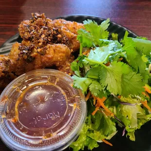  plate of fried chicken and a salad
