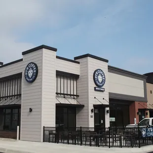 Cafe exterior from the parking lot. Drive-thru lane is at left.