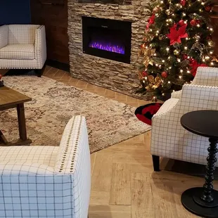 a christmas tree in the lounge area