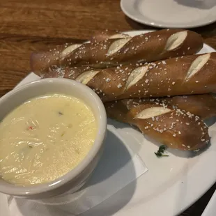 Pretzel sticks with cheese sauce