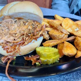 Pulled pork sandwich with pub fries.