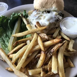 Grilled chicken sandwich with sautéed onions, mushrooms and Swiss