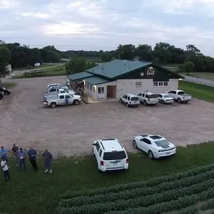 a group of people standing in a parking lot