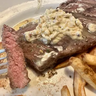a steak and french fries on a plate
