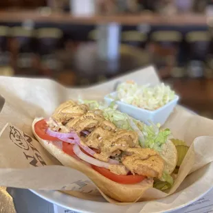 a chicken sandwich and coleslaw