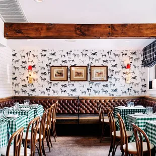 a dining room with green and white checkered tablecloths