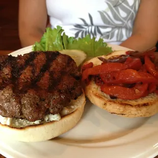 Beef patty with Cajun, blue cheese, grilled onions and roasted red peppers on a Kaiser