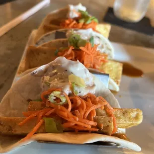 Vegan tofu tacos with cashew aioli and carrot salad