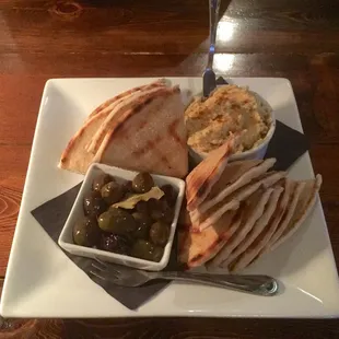 Classic Hummus.  Pita bread toasted, as well as the olives are served warm.