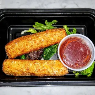 Cheese Steak Spring Rolls filled with Cheddar Cheese, Caramelized Onions and served with - Spicy Ketchup $12