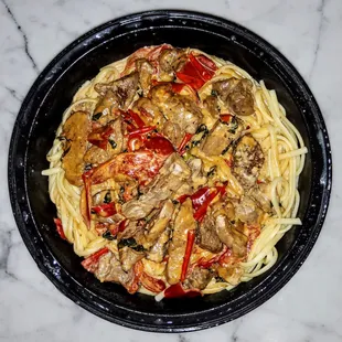 Filet Tips served over Linguini: Filet Tips with Roasted Peppers in a Blue Cheese Demi Cream Sauce over Linguini. $23
