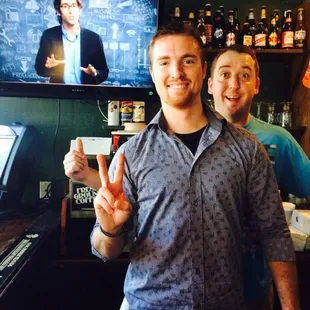 a man holding up a peace sign