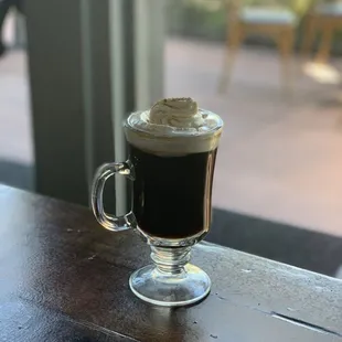 House Irish Coffee with sprinkled with cinnamon dust &amp; a candy cane whiskey crumble