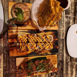 Tostones with ceviche, crunchy salmon roll, and bigeye tuna roll