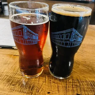 two glasses of beer on a table