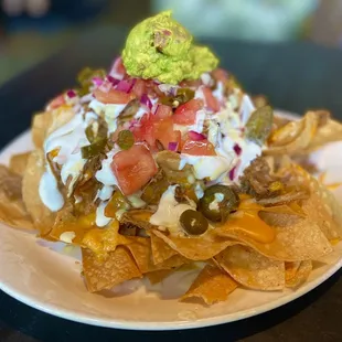 Pulled pork nachos $16.25, half off for HH, M-F 3-6