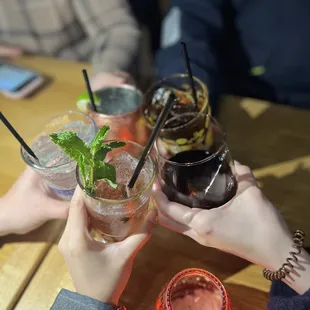 a group of people toasting drinks