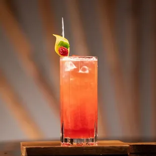 a cocktail in a tall glass