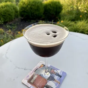 a drink in a glass on a table
