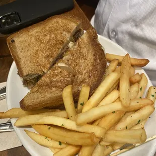 a sandwich and fries on a plate